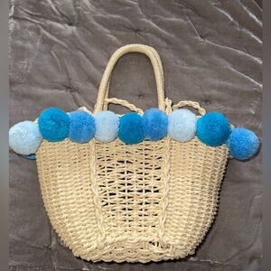 Woven Straw Tote with Blue Pom Poms